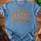 Blue t-shirt with "PRETTY CHAOTIC & OUT OF MANA" text and leopard print.