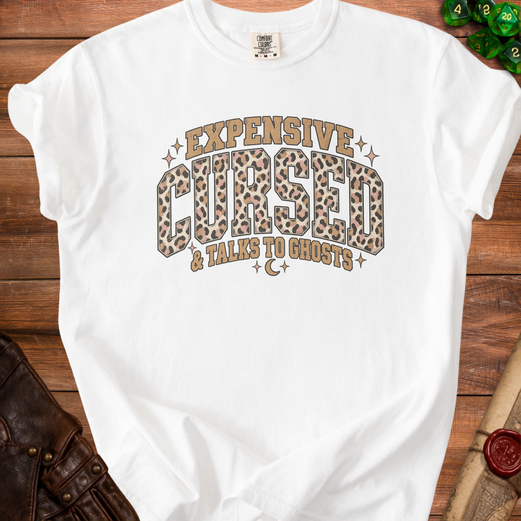 White t-shirt with "Expensive Cursed & Talks to Ghosts" text.