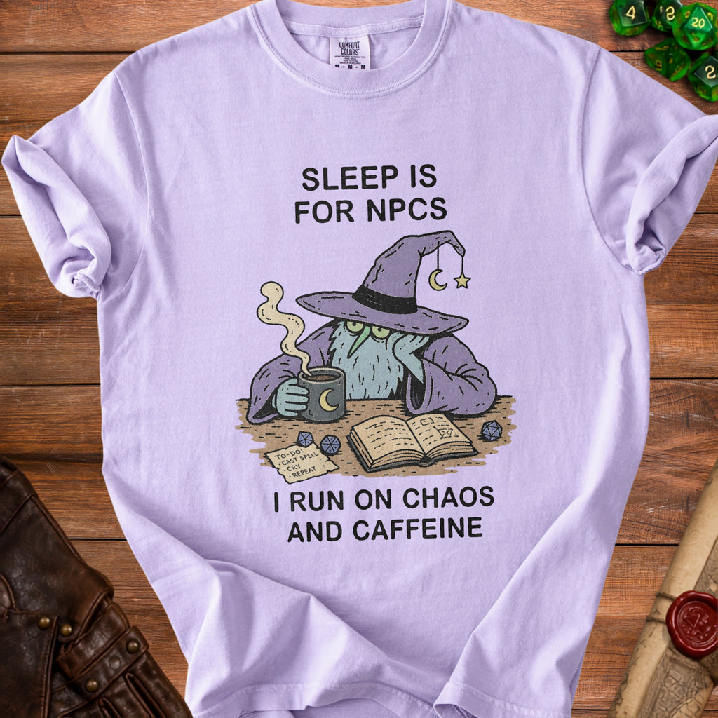 Lilac t-shirt with wizard graphic and text: "Sleep is for NPCs. I run on chaos and caffeine."
