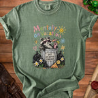 T-shirt with raccoon in trash can, "Mentally on Vacation" text, and "Out of Office Forever" sign.