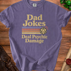 Purple t-shirt with "Dad Jokes Deal Psychic Damage" text and D20 die graphic.