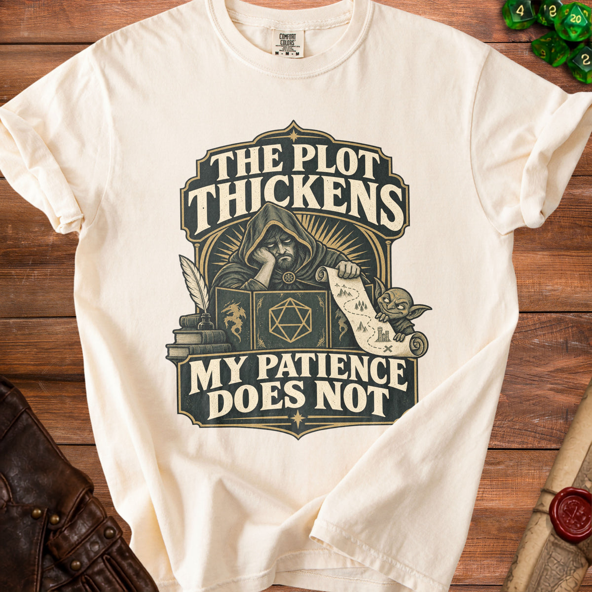 Cream t-shirt with "The Plot Thickens, My Patience Does Not" graphic and wizard.
