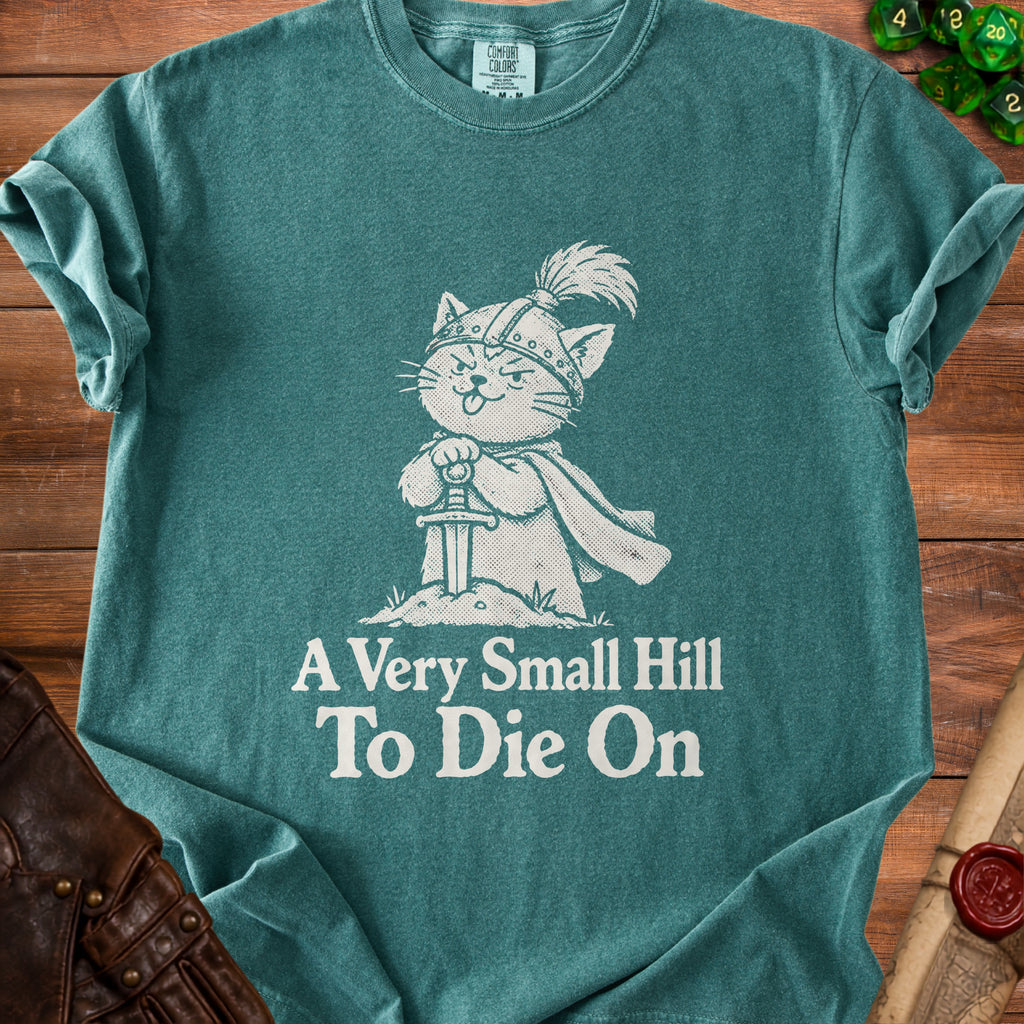 Green t-shirt with a knight cat design and text "A Very Small Hill To Die On".