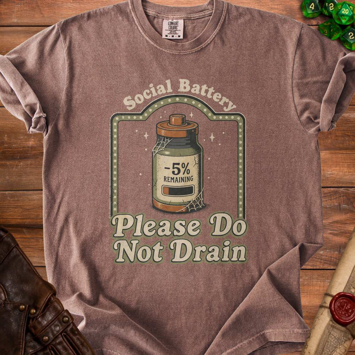 Brown t-shirt with "Social Battery -5% Remaining Please Do Not Drain" graphic.