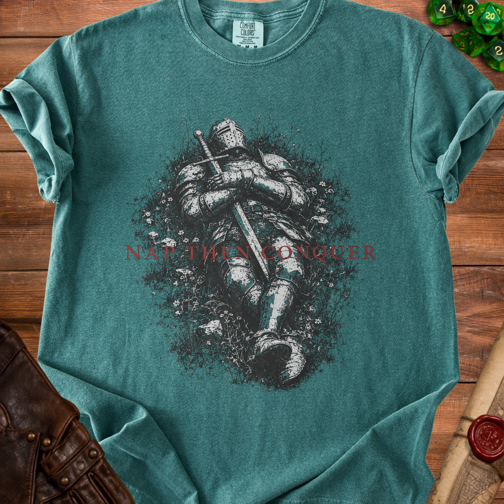 Teal t-shirt with knight artwork and "NOT THEN CONQUER" text.