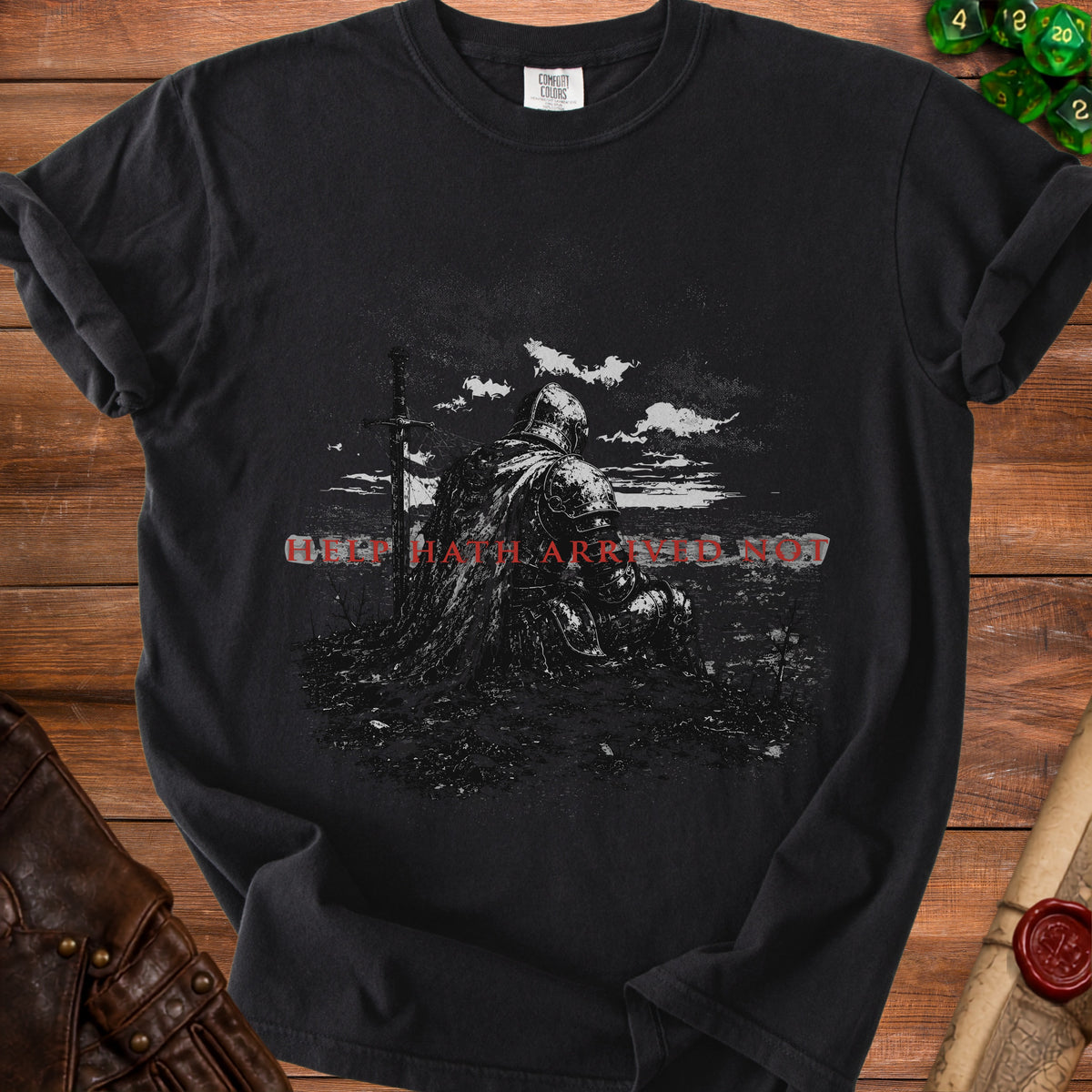 Black t-shirt with knight and sword graphic and red text "HELP THAT ARRIVED NOT".