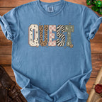 Blue t-shirt with "QUEST" graphic featuring celestial and animal prints.