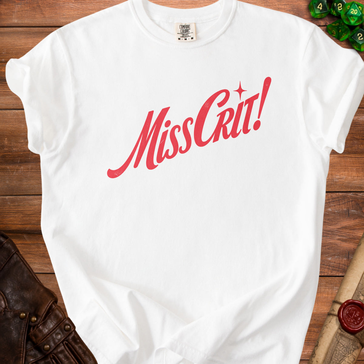 White t-shirt with red text reading "Miss Grit!" and a small sparkle.