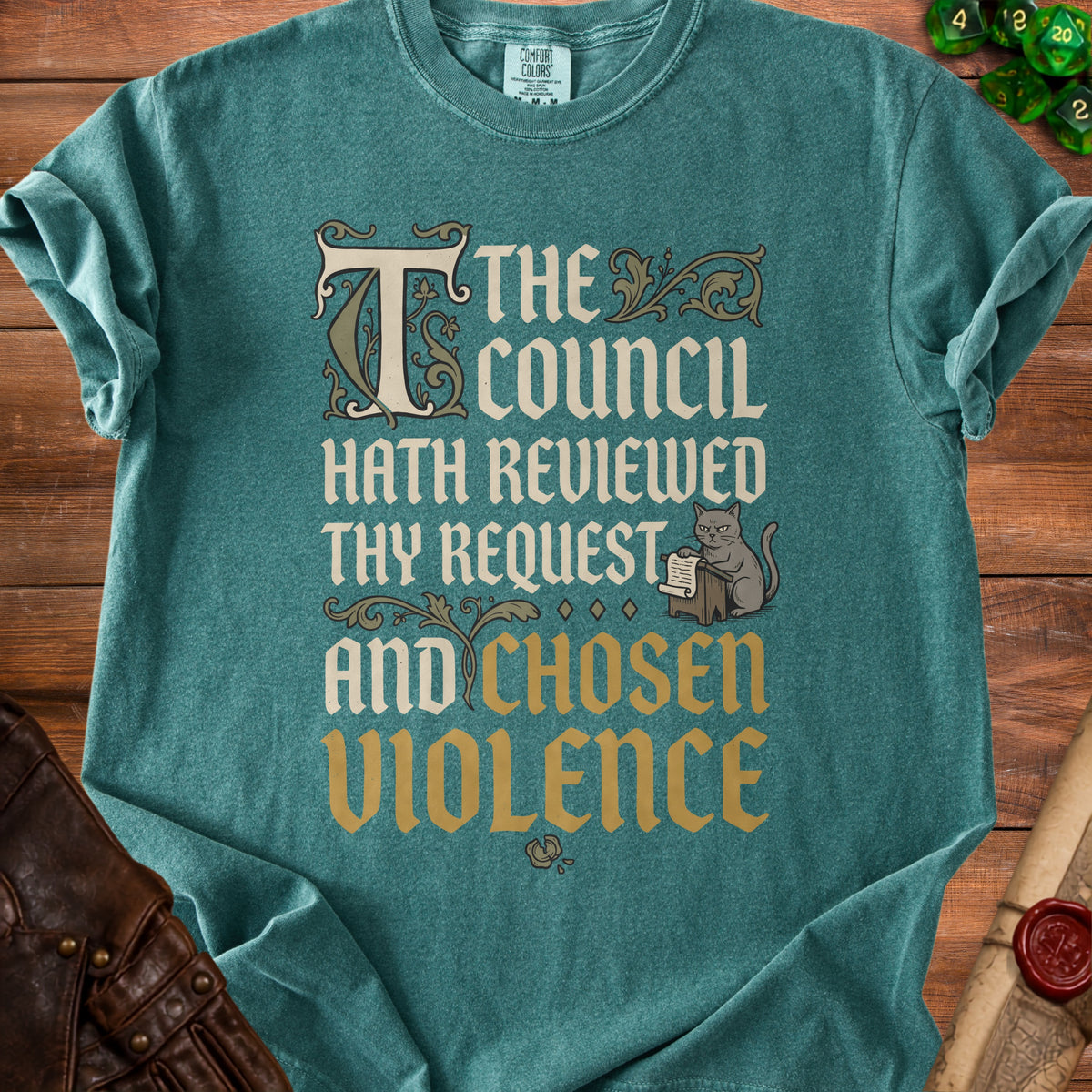 Teal t-shirt with "The council hath reviewed thy request and chosen violence" text.