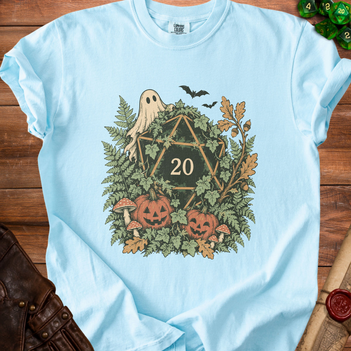 Light blue t-shirt with a D20 dice, ghost, pumpkins, and foliage graphic.