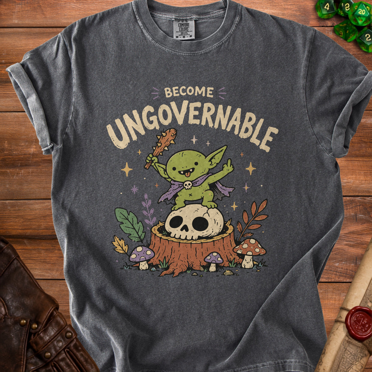 Dark grey t-shirt with "BECOME UNGOVERNABLE" text and a green creature on a skull.
