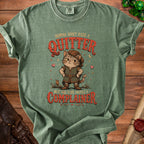 Green t-shirt with cat in medieval outfit saying "Momma didn't raise a quitter, but she sure raised a complainer."