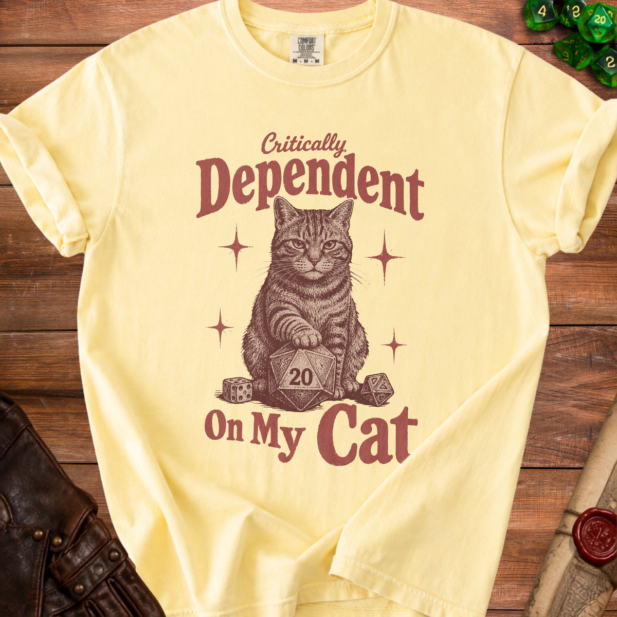 Yellow t-shirt with a cat graphic and text "Critically Dependent On My Cat".