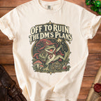 Cream t-shirt with "Off to Ruin The DM's Plans" text and a wizard frog.