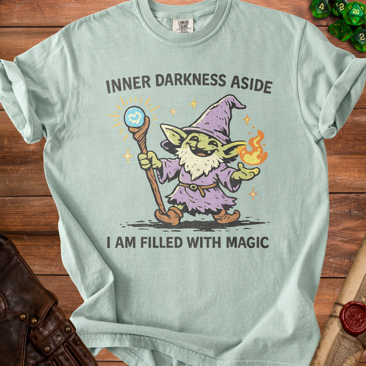 Light blue t-shirt with a goblin wizard graphic and text "INNER DARKNESS ASIDE I AM FILLED WITH MAGIC."