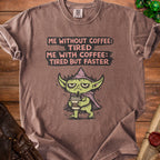 Brown t-shirt with a grumpy green character holding coffee and text.