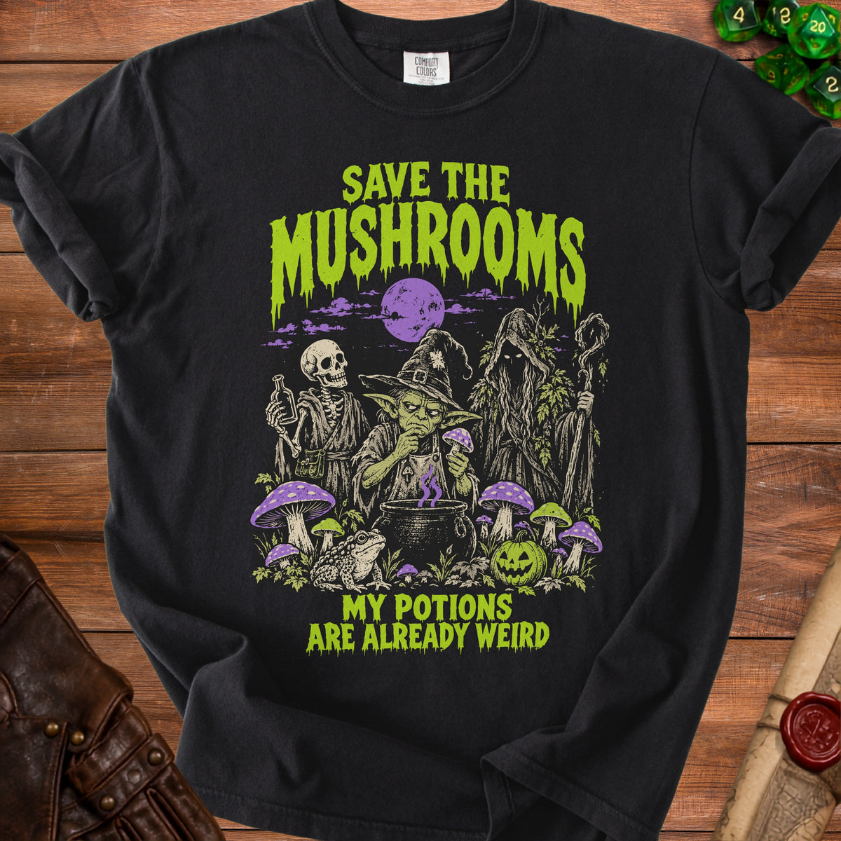 Black t-shirt with "Save the Mushrooms My Potions Are Already Weird" text and gothic illustration.
