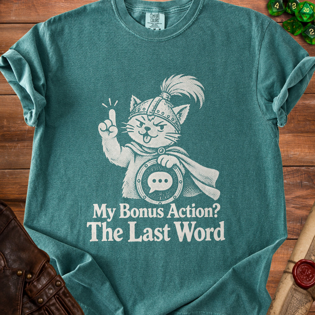 Green t-shirt with a white graphic of a cat in armor and the text "My Bonus Action? The Last Word".