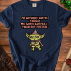 Navy t-shirt with cartoon character and text "Me without coffee: Tired. Me with coffee: Tired but faster."