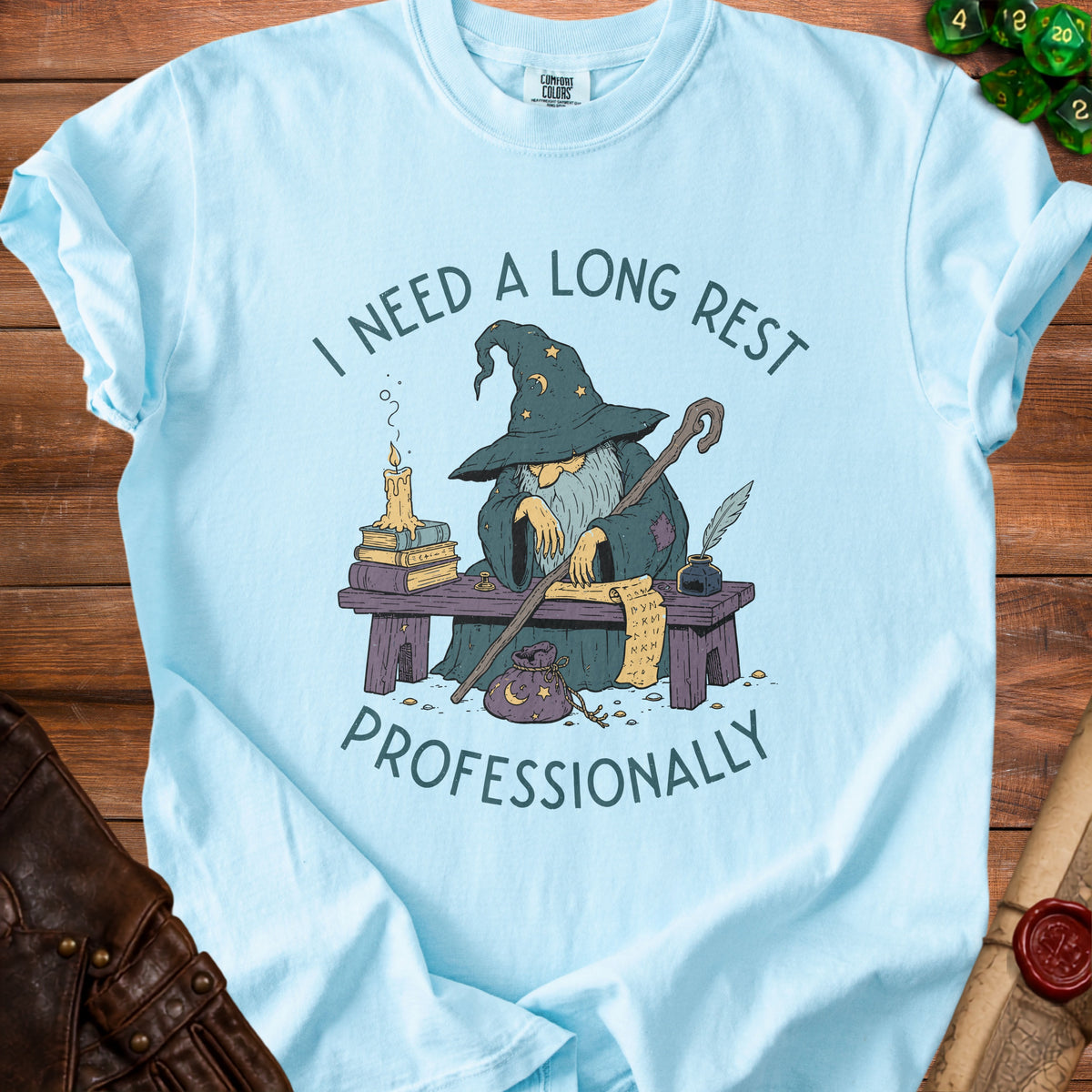 T-shirt with wizard graphic saying "I need a long rest professionally".