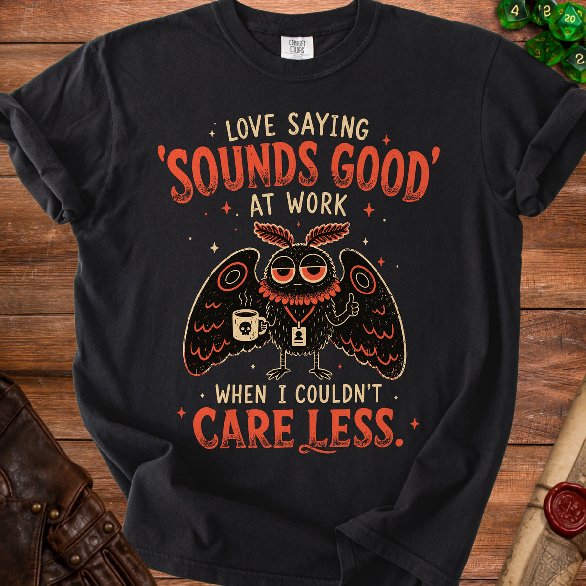 Black t-shirt with moth graphic and text "Love saying 'Sounds Good' at work when I couldn't care less."