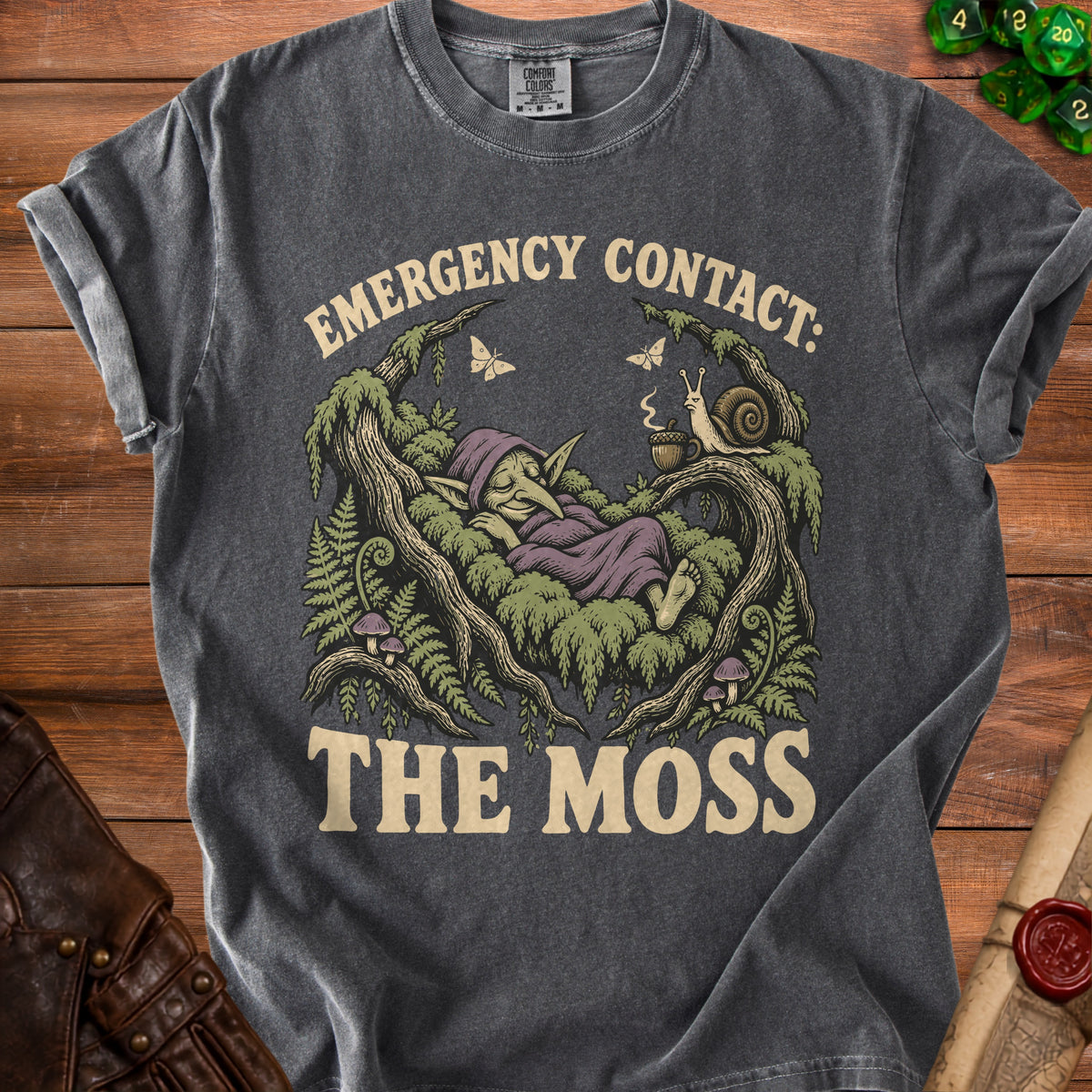 Dark gray t-shirt with a graphic of a sleeping goblin, a snail, and butterflies.