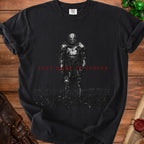 Black t-shirt with a knight in armor and text "JUST HERE TO SUFFER".