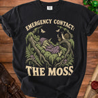 Black t-shirt with a sleeping goblin and text "EMERGENCY CONTACT: THE MOSS."