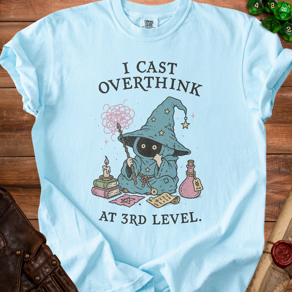 Light blue t-shirt with "I CAST OVERTHINK AT 3RD LEVEL" and wizard graphic.