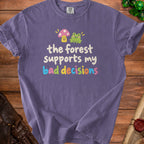 Purple t-shirt with text "the forest supports my bad decisions" and illustrations.