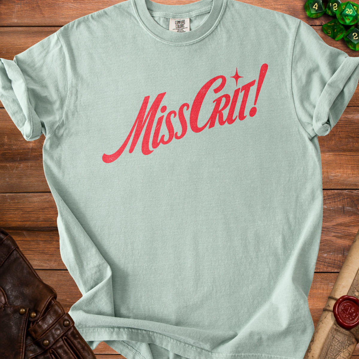 Light blue t-shirt with red "MissCrit!" text and a star.