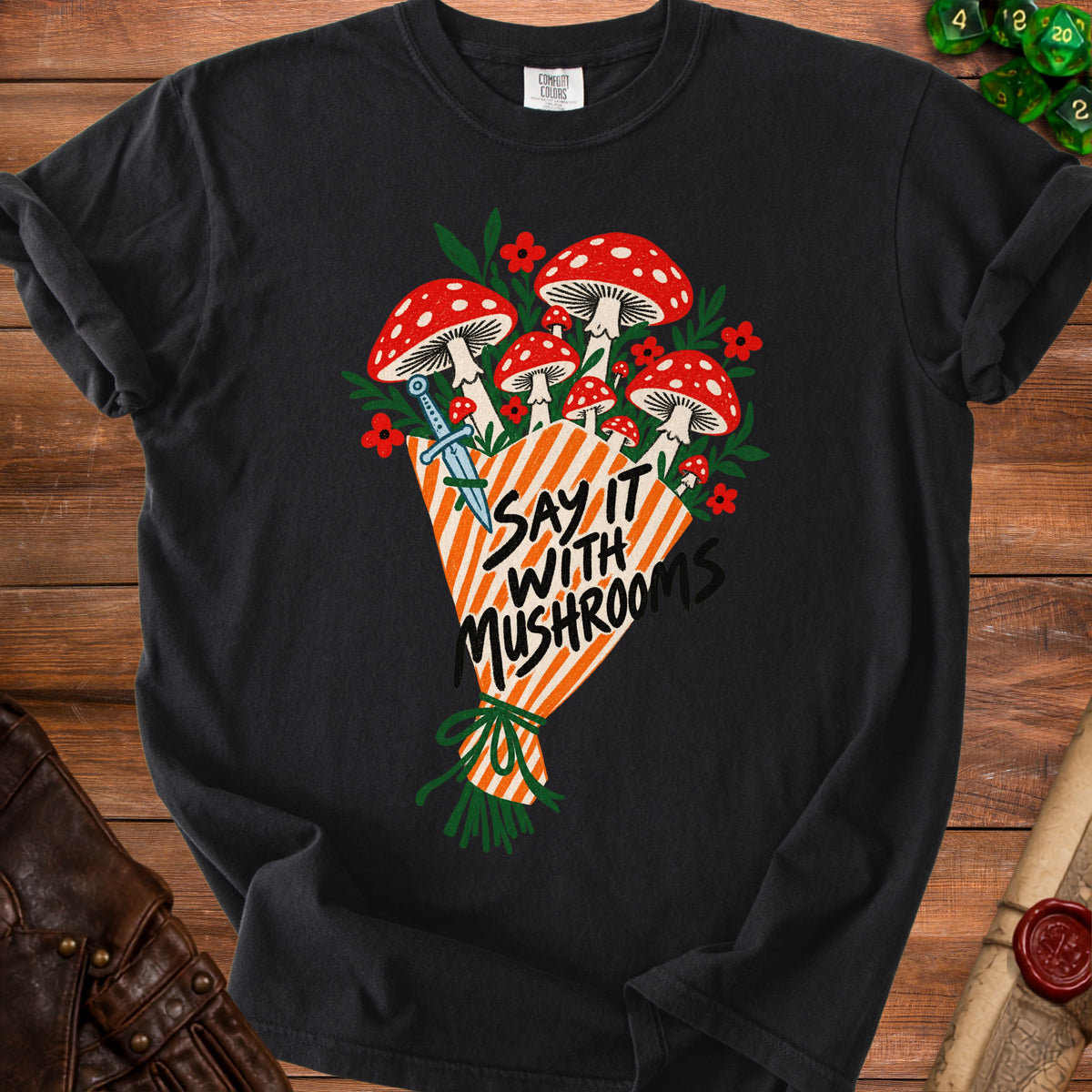 Black t-shirt with red and white mushrooms, a dagger, and text "Say It With Mushrooms".
