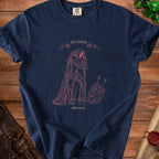 Dark blue t-shirt with illustration of knight, sword, shield, and text "Still standing Unfortunately".