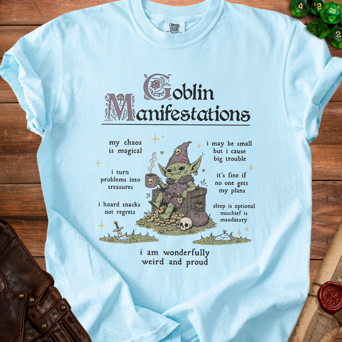 Light blue shirt with "Goblin Manifestations" and a goblin drinking from a skull mug.