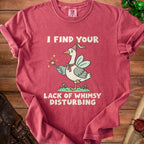 Pink t-shirt with a goose wearing a party hat and holding a wand, reading "I find your lack of whimsy disturbing."