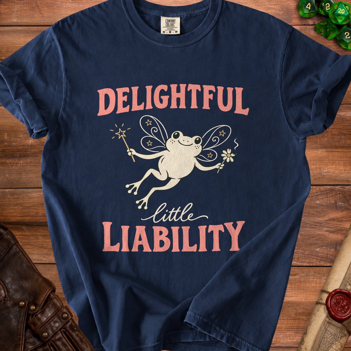 Navy t-shirt with fairy frog graphic and text "Delightful little Liability".
