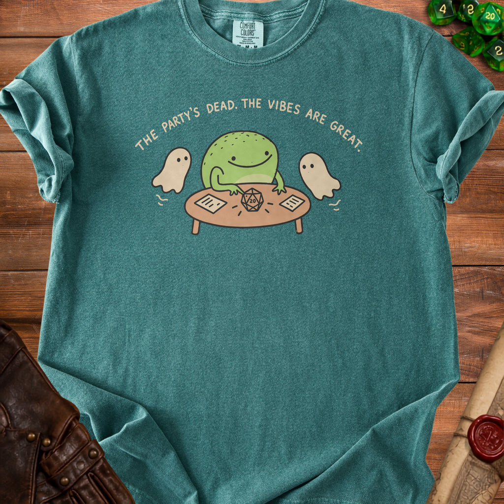 Green t-shirt with frog, ghosts, and dice playing "The Party's Dead. The Vibes Are Great."