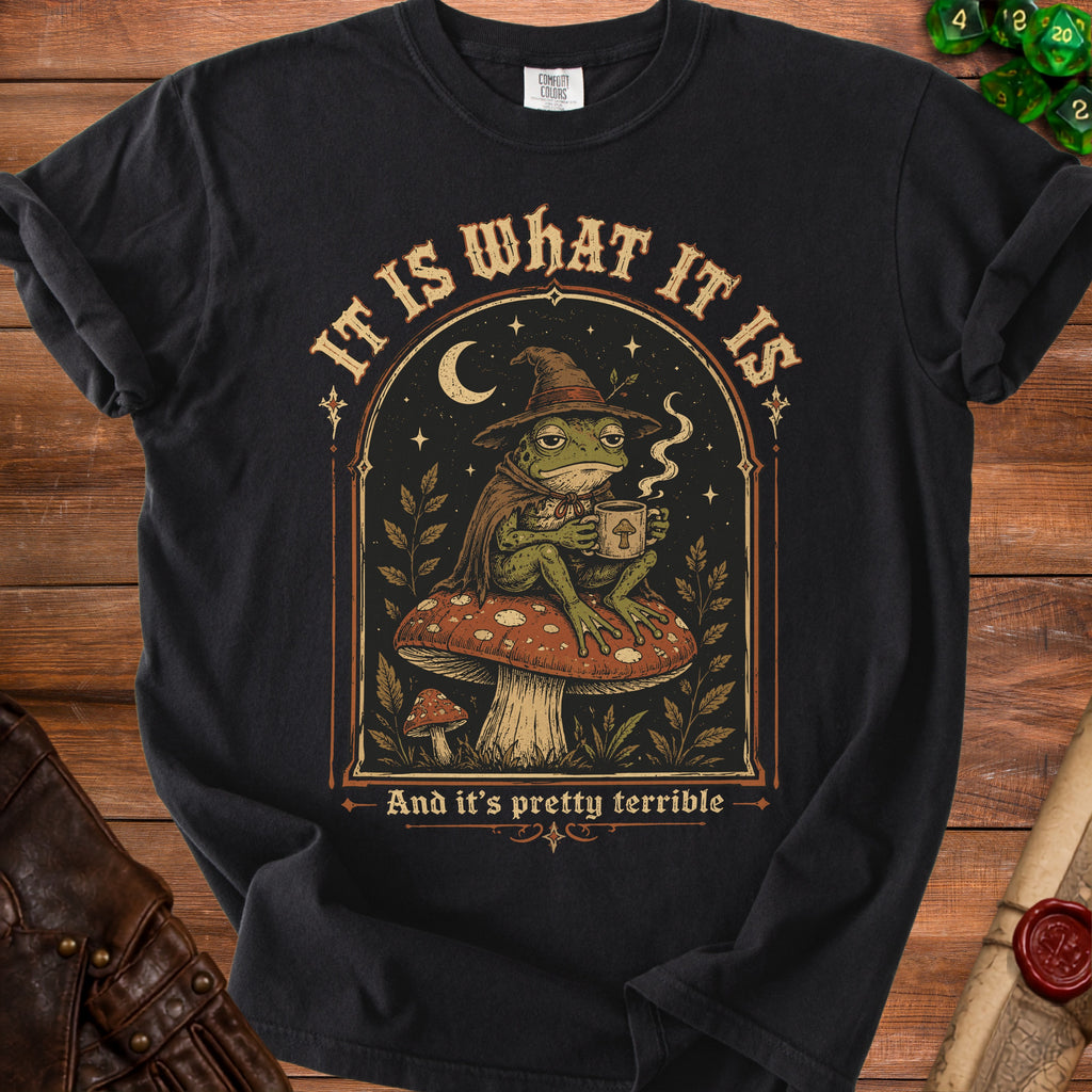 Frog in witch hat with coffee mug, reads "It is what it is and it's pretty terrible."