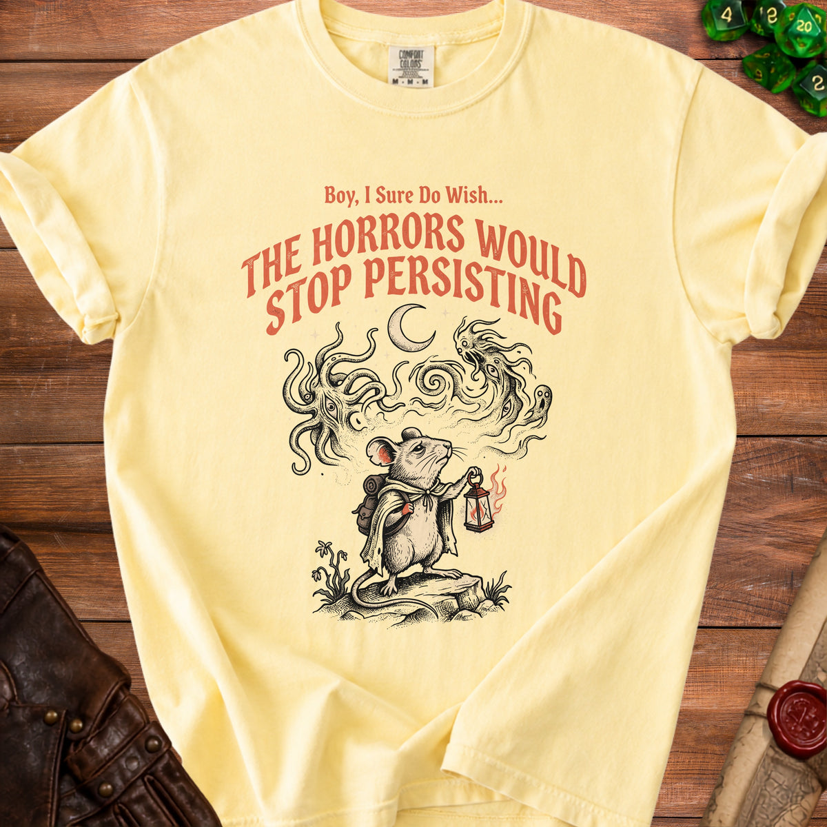 Yellow t-shirt with a mouse holding a lantern and the text "Boy, I Sure Do Wish... THE HORRORS WOULD STOP PERSISTING".