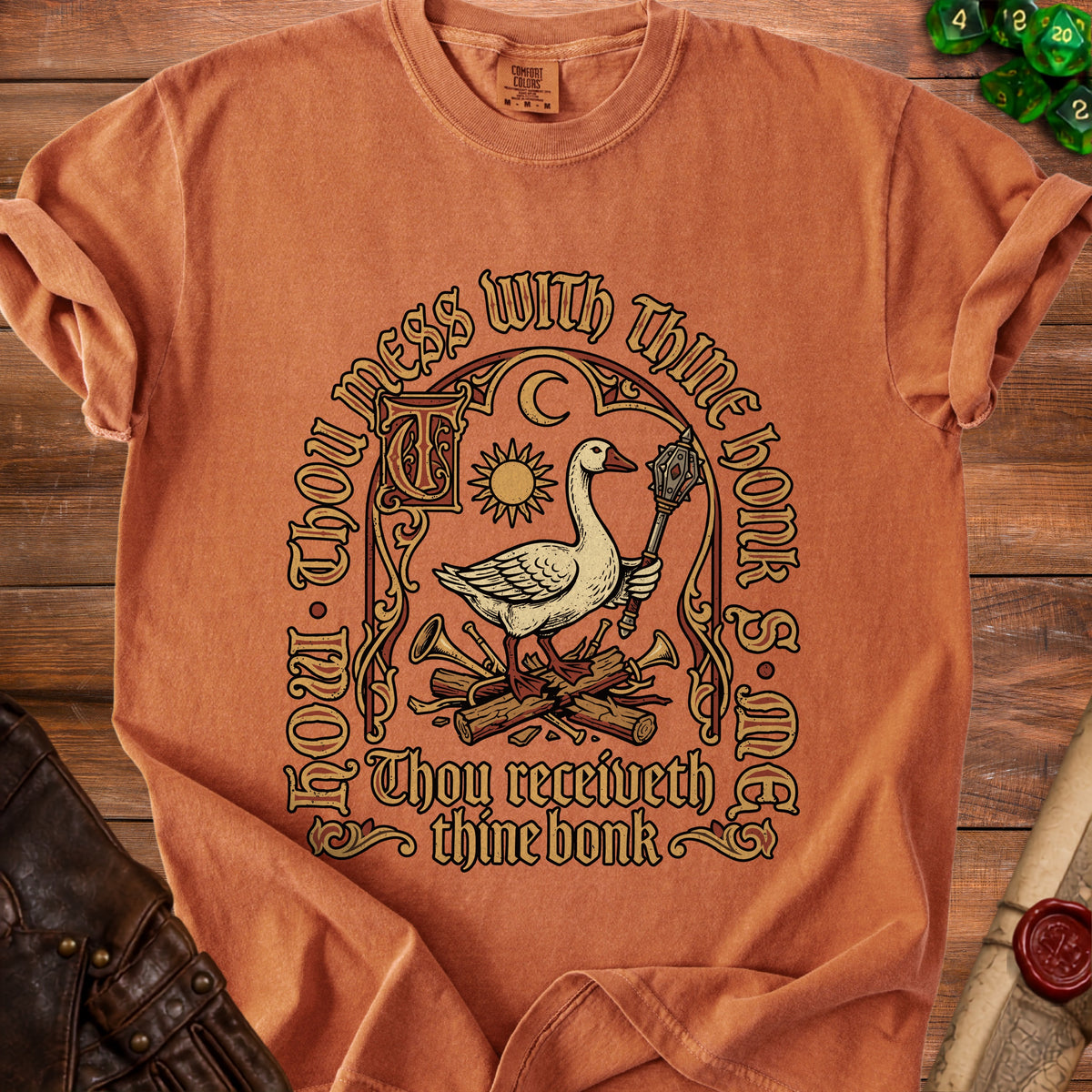 Orange t-shirt with a goose holding a mace and text: Thou receiveth thine bonk.
