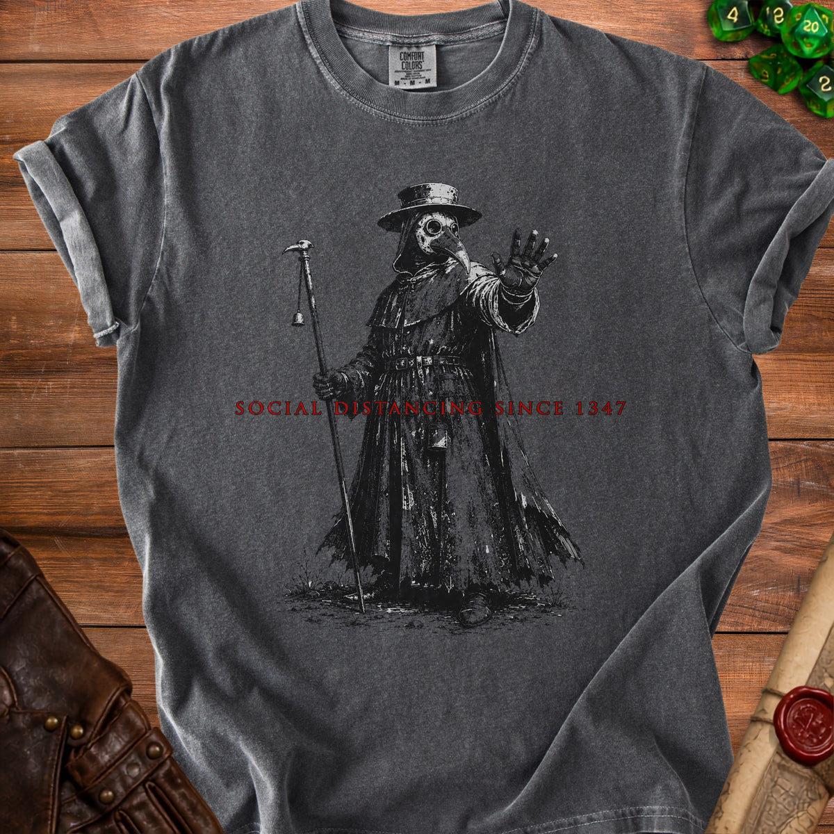 Dark grey t-shirt with plague doctor graphic and "SOCIAL DISTANCING SINCE 1347" text.