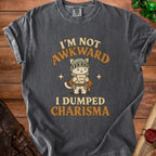 Dark gray t-shirt with knight cat graphic and text "I'm not awkward, I dumped charisma."