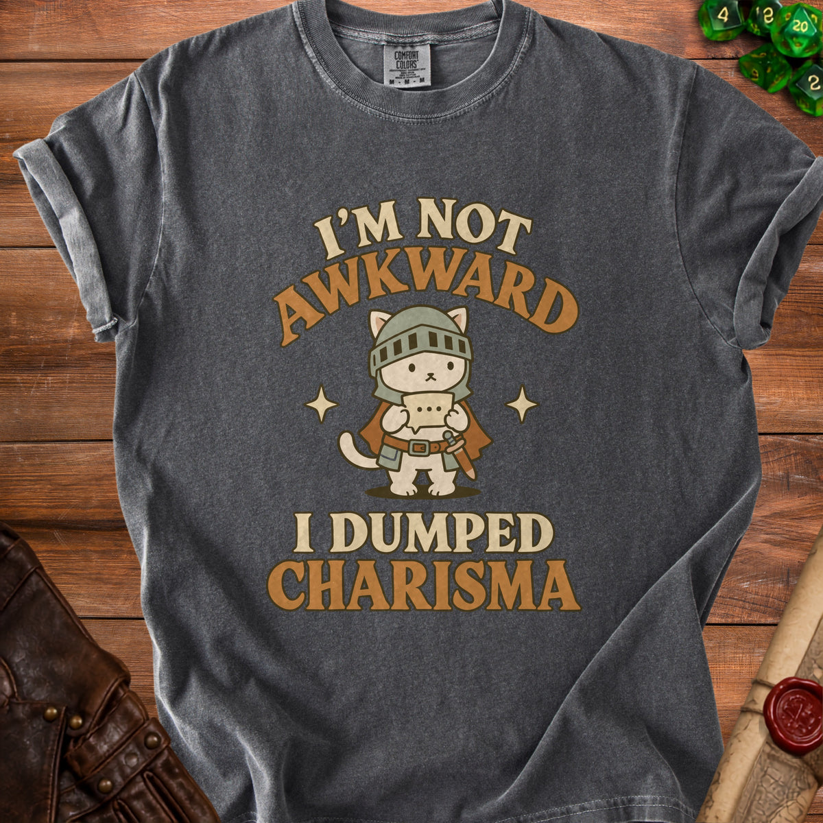 Dark gray t-shirt with knight cat graphic and text "I'm not awkward, I dumped charisma."