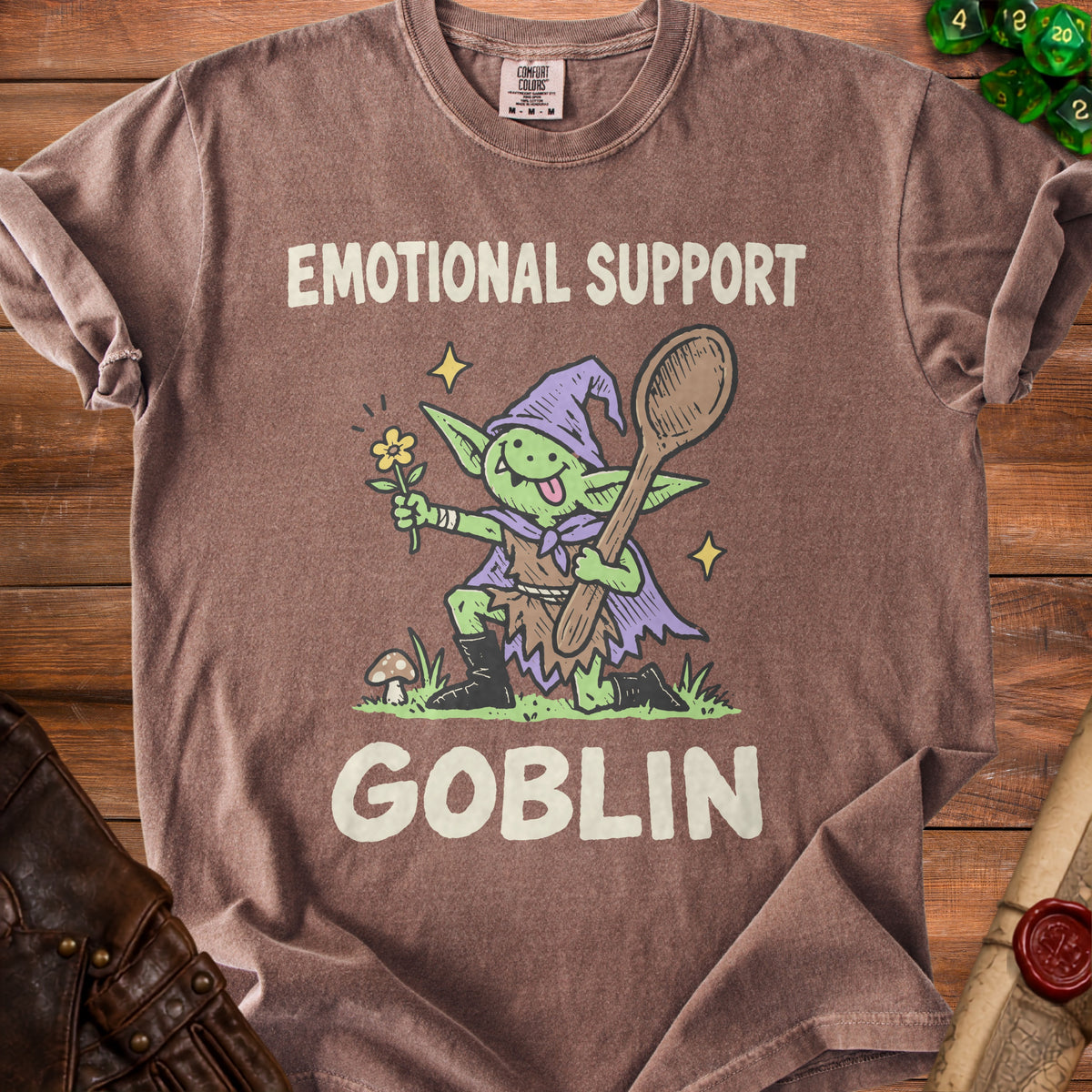 Brown t-shirt with cartoon goblin holding spoon and flower; "EMOTIONAL SUPPORT GOBLIN" text.