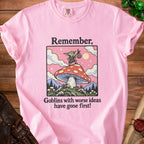 Pink t-shirt with graphic: "Remember, goblins with worse ideas have gone first!"