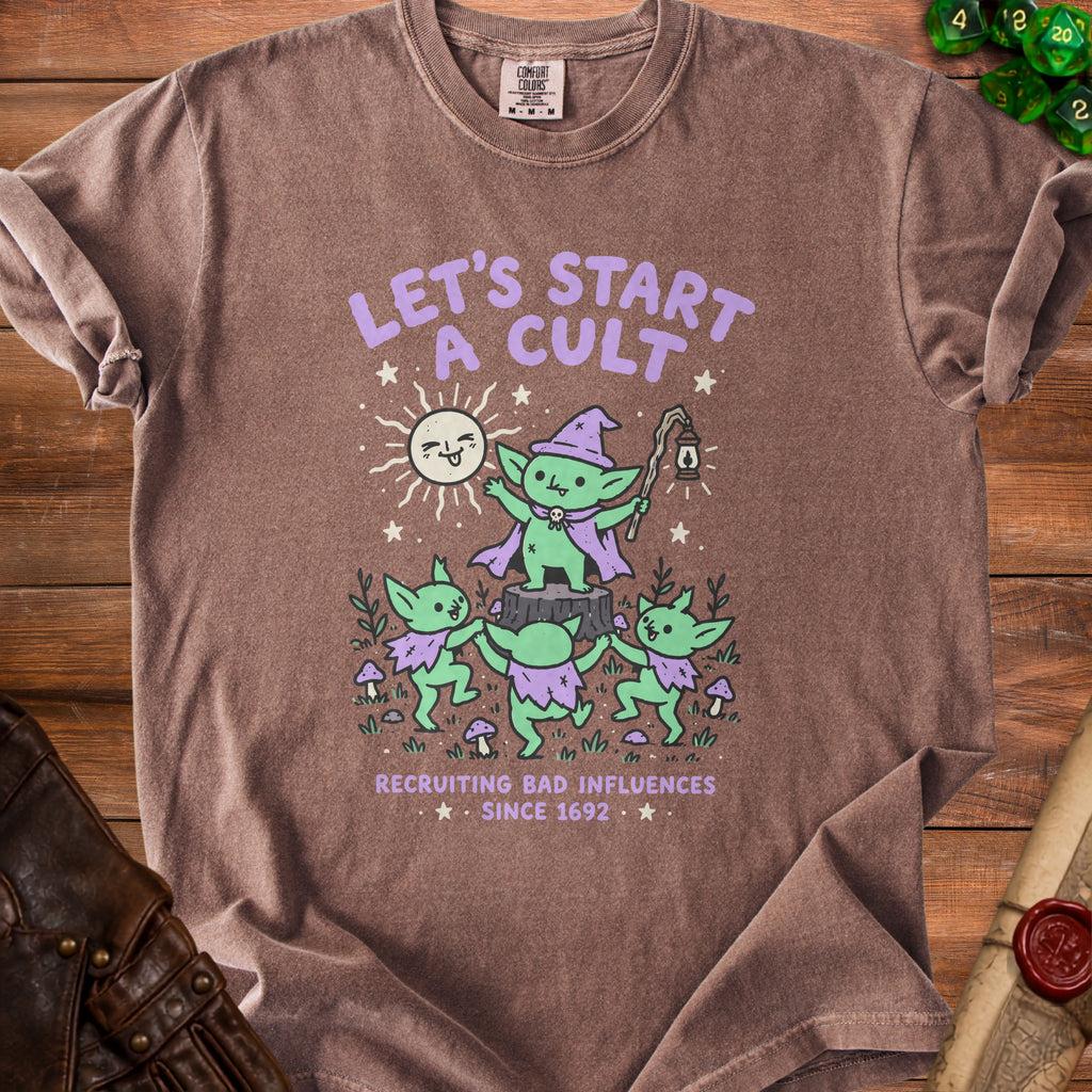Brown t-shirt with goblins and sun graphic, "Let's Start A Cult Recruiting Bad Influences Since 1692".