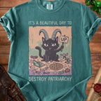 Black cat with goat horns holding an "UP" sign, surrounding items.