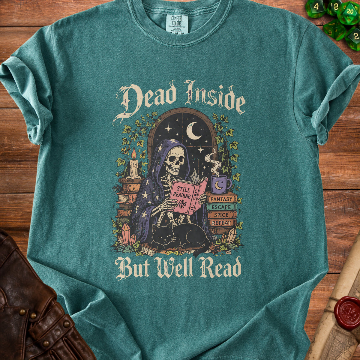 Green t-shirt with skeleton reading a book and black cat. Text reads "Dead Inside But Well Read".