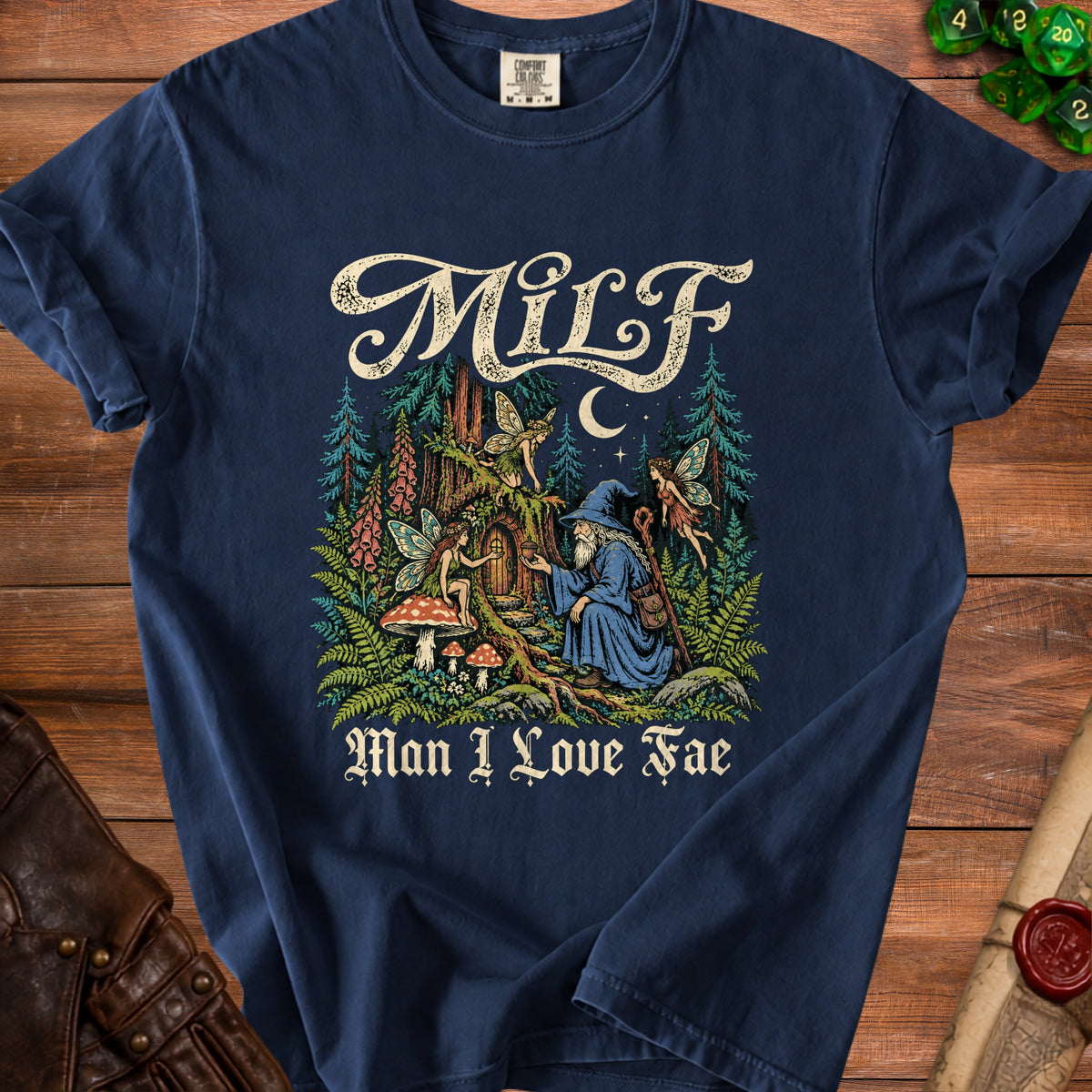 Navy t-shirt with "Milf Man I Love Fae" text and a wizard with fairies in a forest scene.