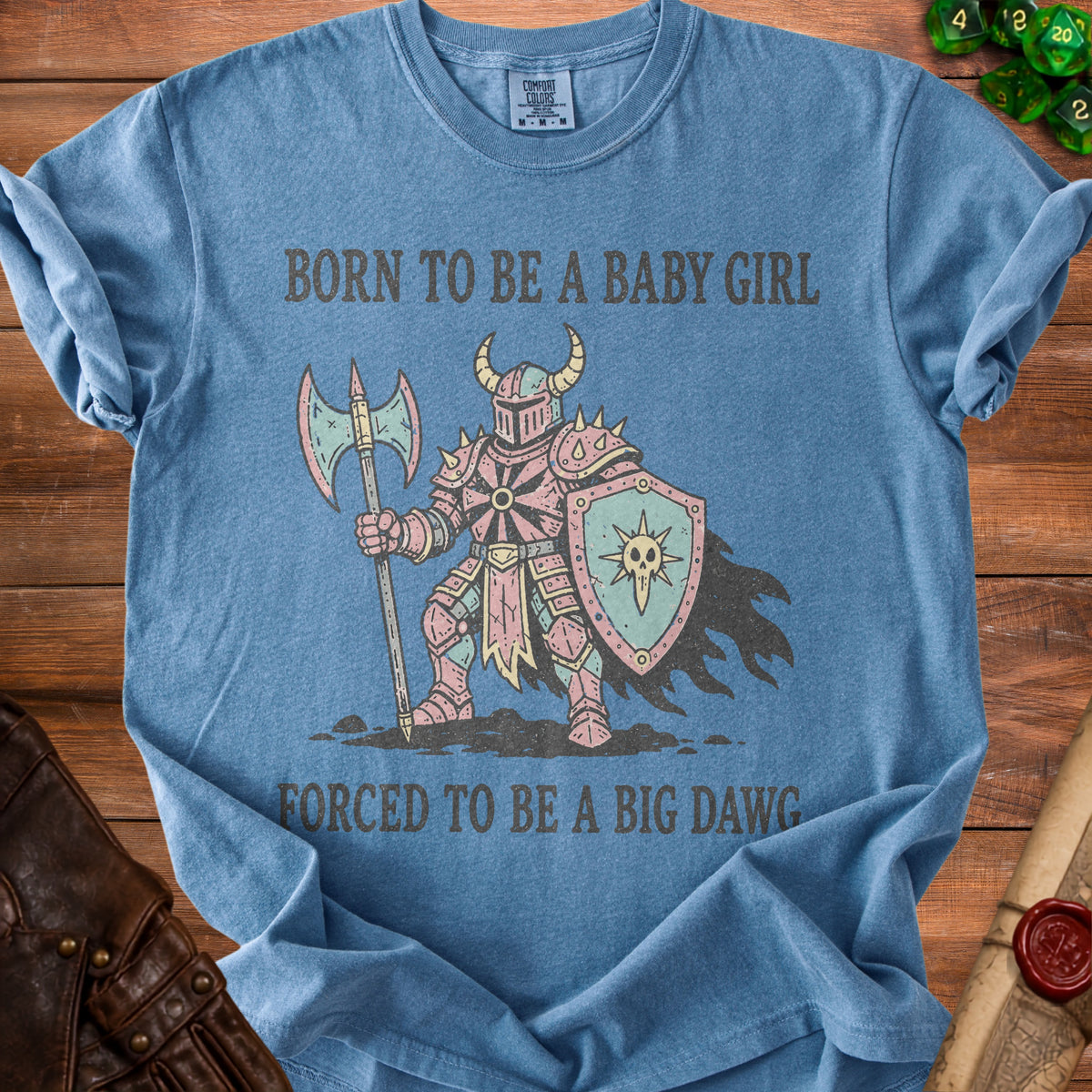 Blue shirt with knight graphic and text "BORN TO BE A BABY GIRL FORCED TO BE A BIG DAWG".